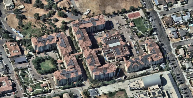 600kW rooftop solar with elevated racking on S-tile roofs at a National City senior living campus, installed by Keen Energy
